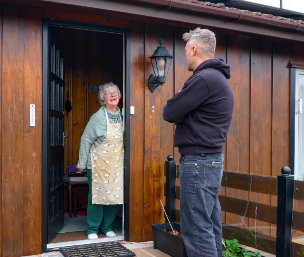 Happy customer with Smart Energy Homes employee